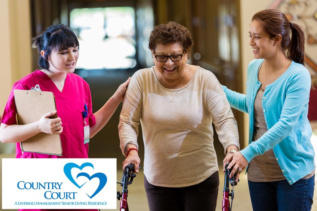 Confident physical therapist assists senior woman in skilled nursing facility